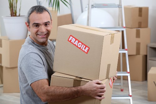 House removals team planning a move in a Teddington residential street