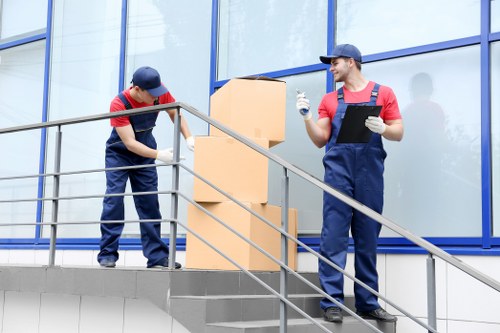 Mover handling boxes carefully during a residential van loading process