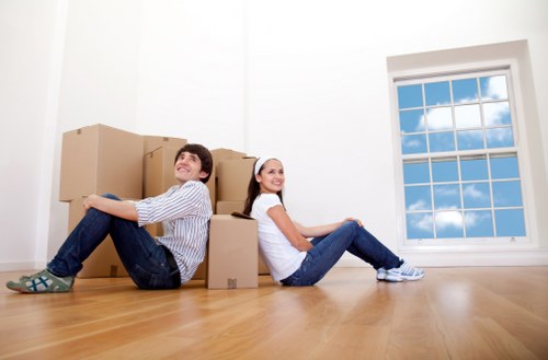 Movers unloading household items at a Teddington home