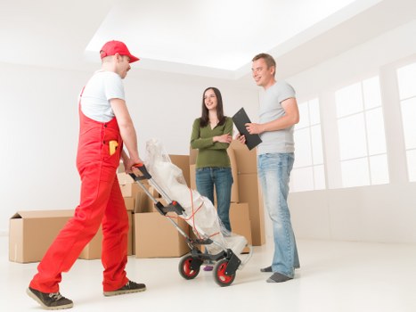 Careful loading of furniture for a small house move in Teddington