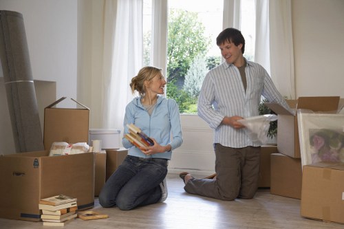 Packed boxes and furniture prepared for a house move in Teddington