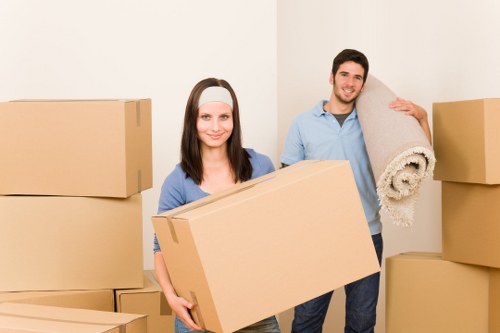 Packed office furniture and equipment prepared for transport during a commercial move